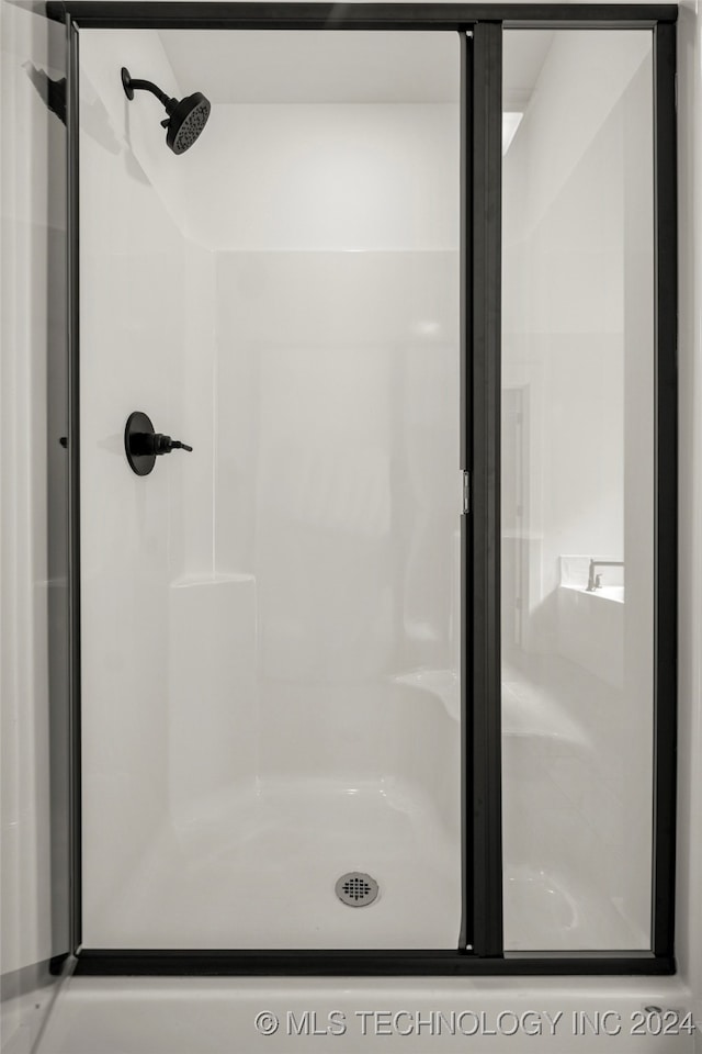 bathroom with an enclosed shower