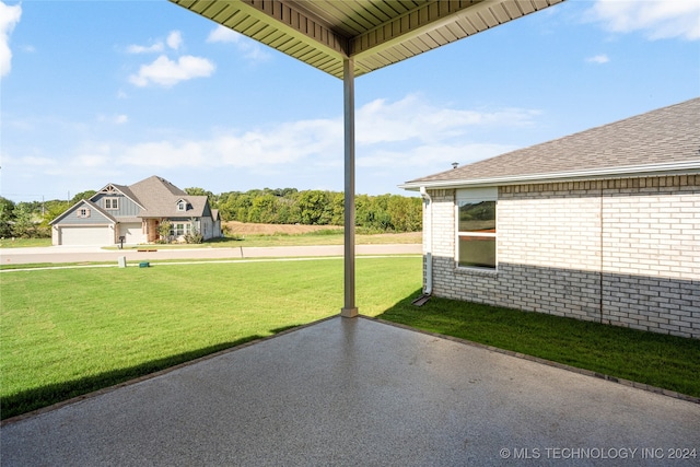 view of patio featuring a garage