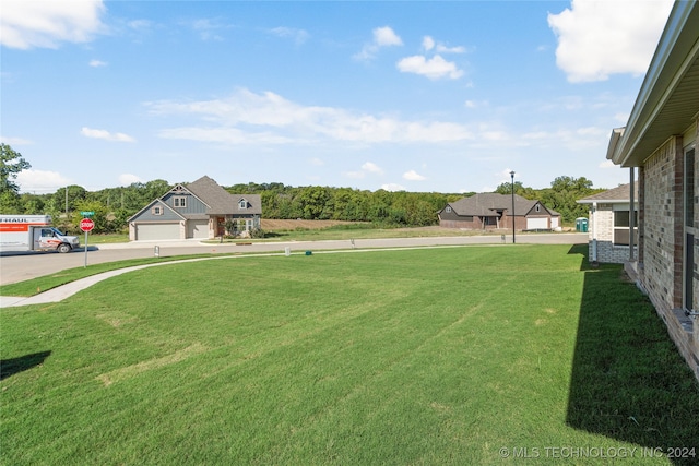 view of yard with a garage