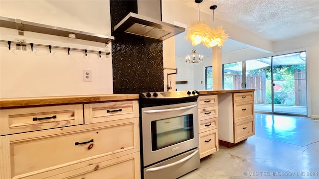 kitchen featuring stainless steel electric stove, butcher block countertops, pendant lighting, a textured ceiling, and a notable chandelier