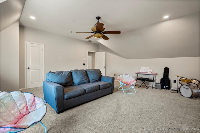 living room with lofted ceiling, carpet flooring, and ceiling fan