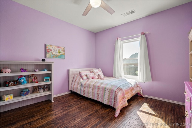 bedroom with a ceiling fan, baseboards, visible vents, and dark wood-style flooring