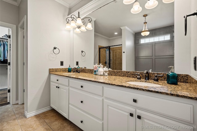 bathroom with a shower with door, tile patterned flooring, crown molding, and vanity