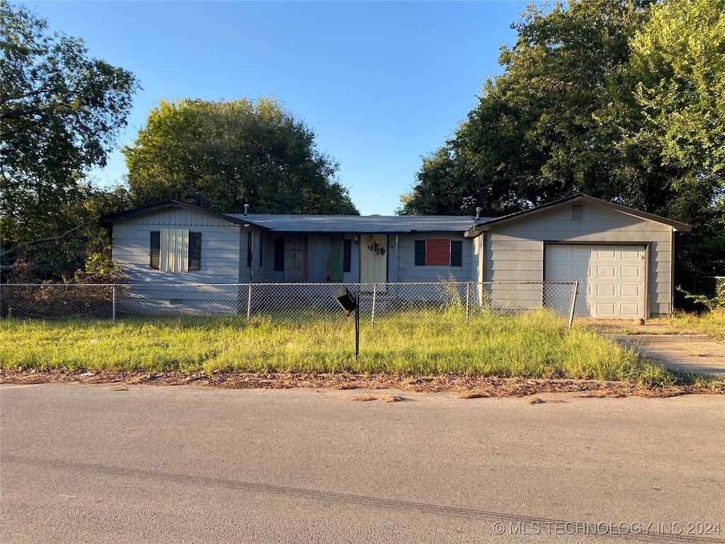 single story home with a garage