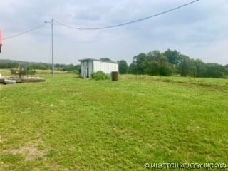 view of yard with a storage unit