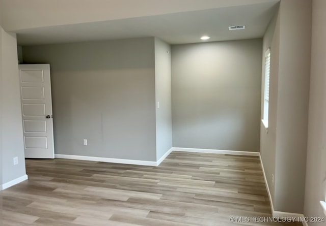 empty room with light hardwood / wood-style floors