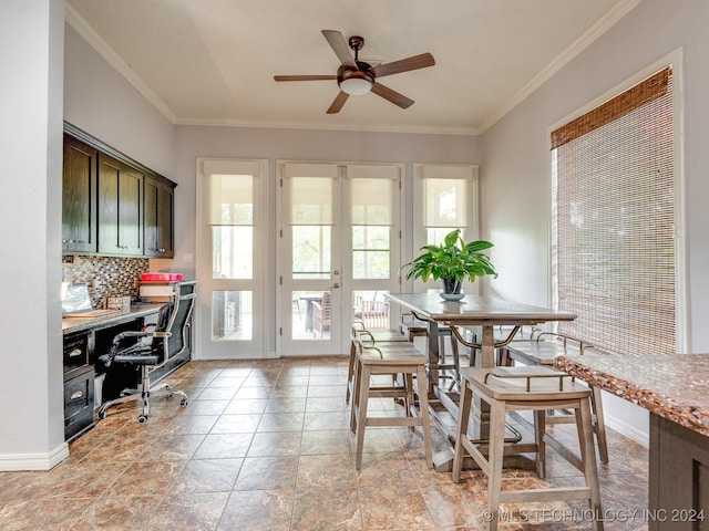 dining area with ornamental molding, ceiling fan, and french doors