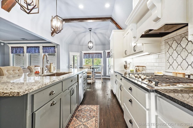 kitchen with stainless steel gas cooktop, sink, decorative light fixtures, white cabinets, and gray cabinets