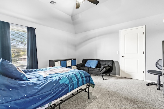 bedroom featuring carpet floors, ceiling fan, and lofted ceiling