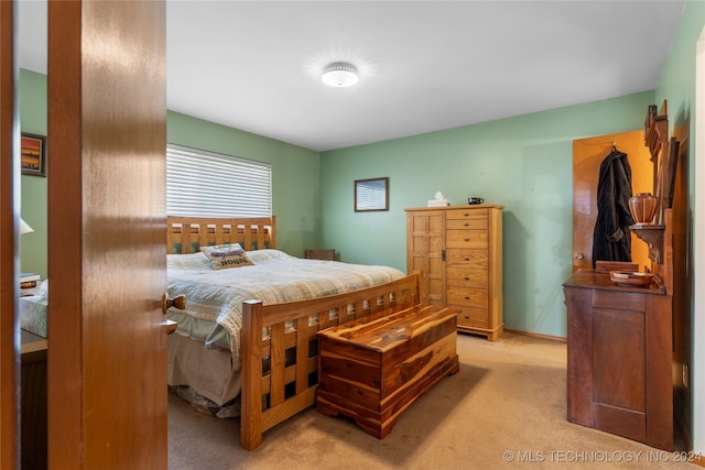 bedroom with light carpet