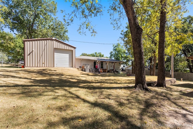 garage featuring a yard