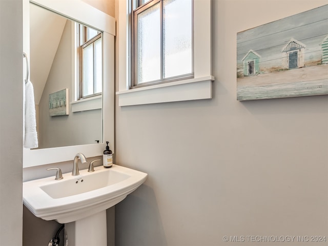 bathroom with lofted ceiling