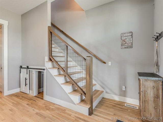 stairs with wood-type flooring