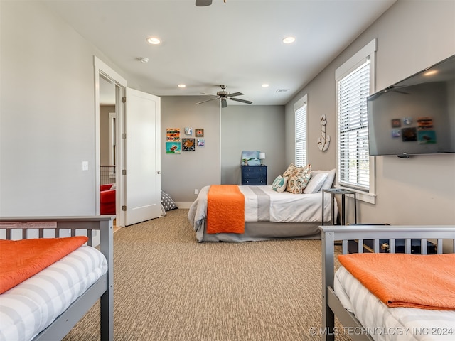 carpeted bedroom with ceiling fan