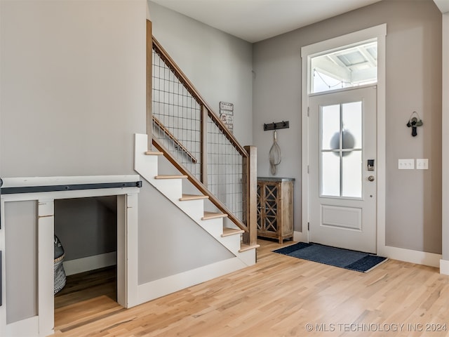 foyer entrance with hardwood / wood-style flooring