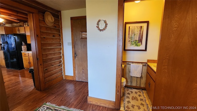 hall with dark wood-type flooring