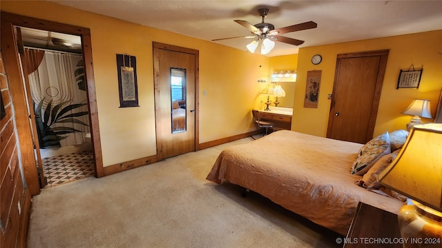 bedroom with ceiling fan and light colored carpet