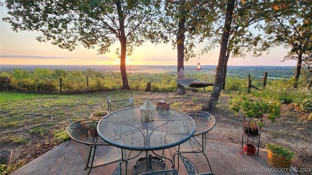 view of patio terrace at dusk