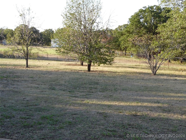 view of yard with a rural view