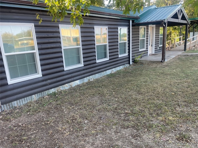 view of side of home with a patio area