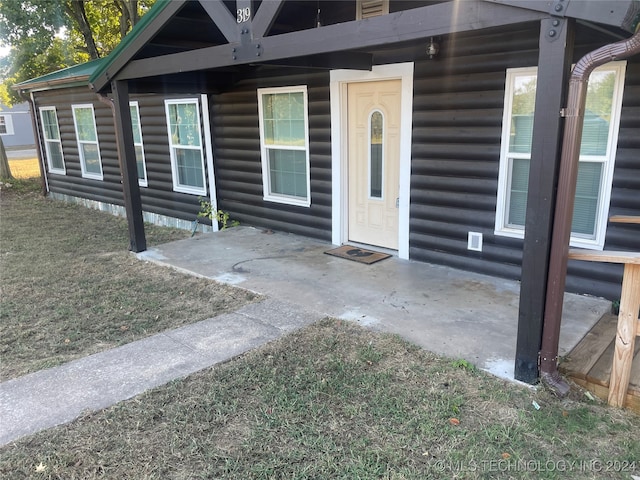 property entrance with a patio area