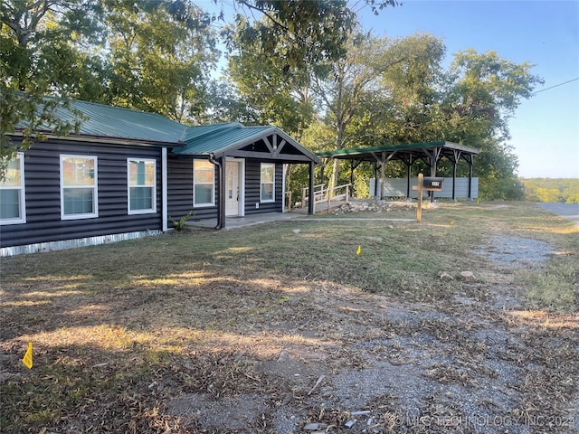 view of front facade with a carport