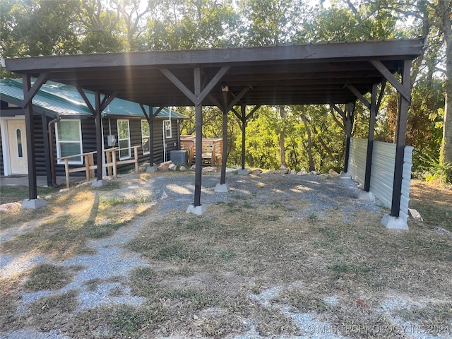 view of vehicle parking with a carport