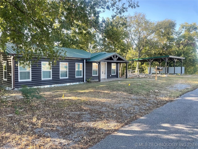 view of front facade with a carport