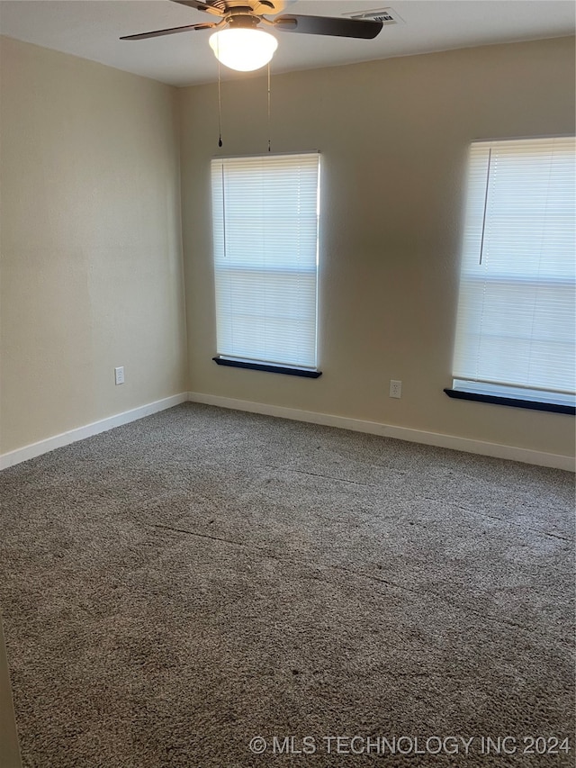 carpeted empty room with ceiling fan