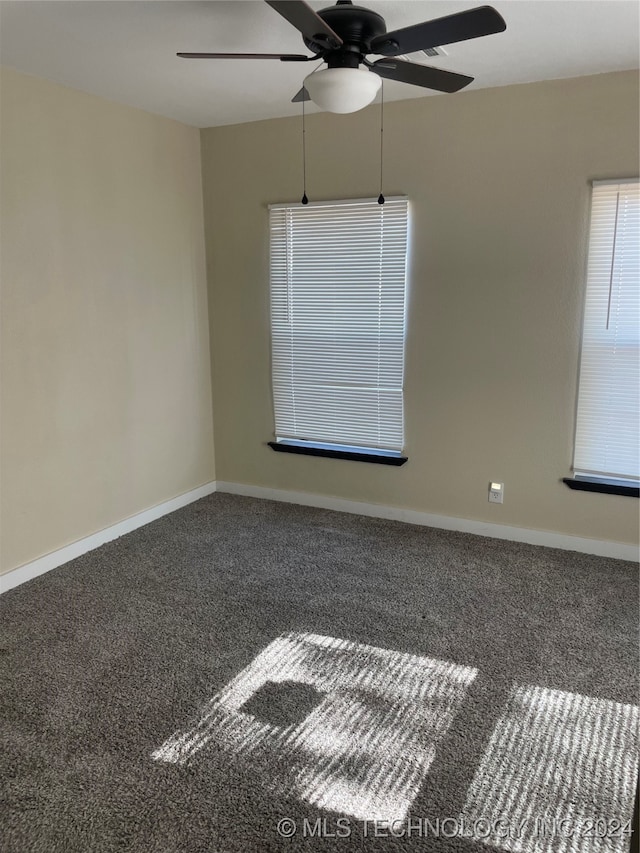 empty room with carpet flooring and ceiling fan