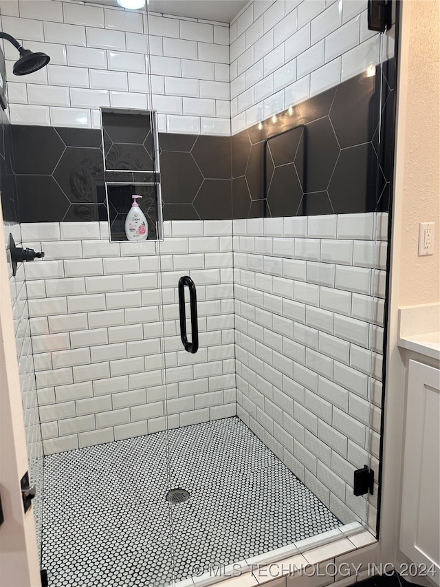 bathroom with vanity and an enclosed shower