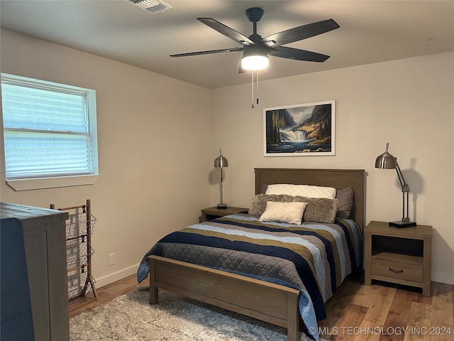 bedroom featuring ceiling fan and wood-type flooring