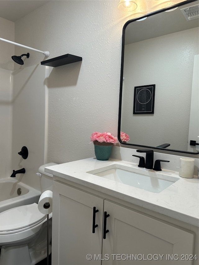 full bathroom with vanity, bathing tub / shower combination, and toilet