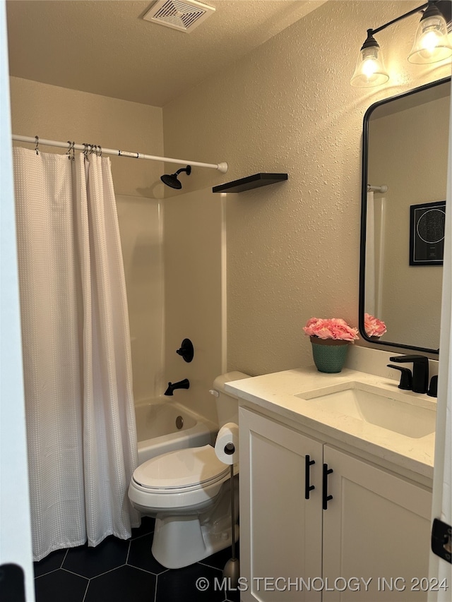 full bathroom featuring vanity, shower / bath combination with curtain, tile patterned floors, toilet, and a textured ceiling