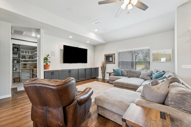 living room featuring lofted ceiling, ceiling fan, and dark hardwood / wood-style flooring