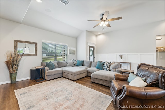 living room featuring ceiling fan, vaulted ceiling, and dark hardwood / wood-style flooring