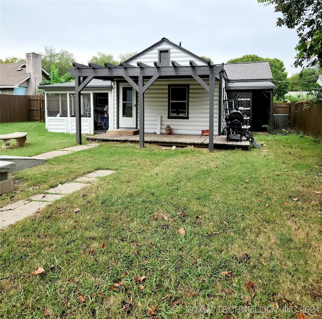 view of front of home featuring a deck and a front yard