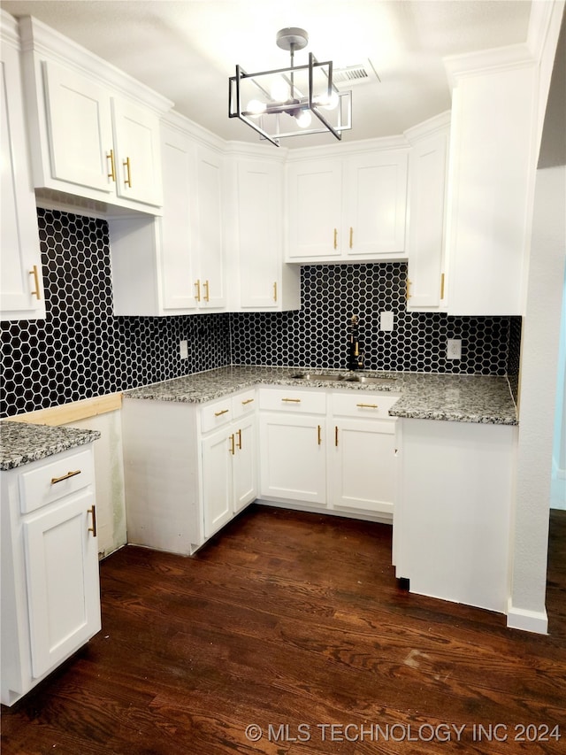 kitchen featuring white cabinets, tasteful backsplash, and dark hardwood / wood-style flooring