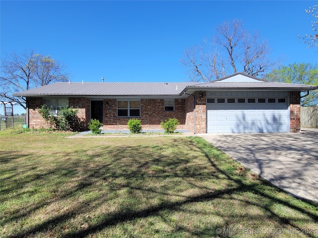 ranch-style home with a front yard and a garage