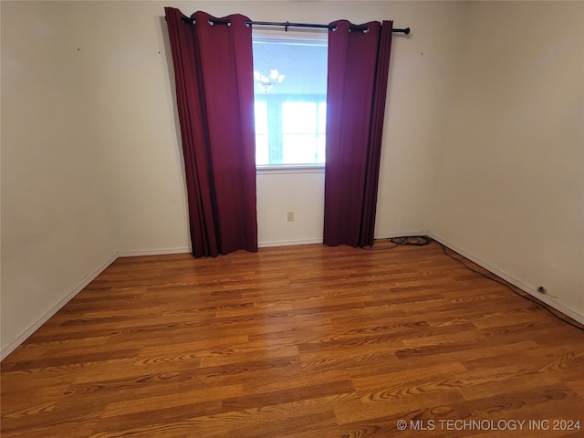 spare room featuring hardwood / wood-style floors