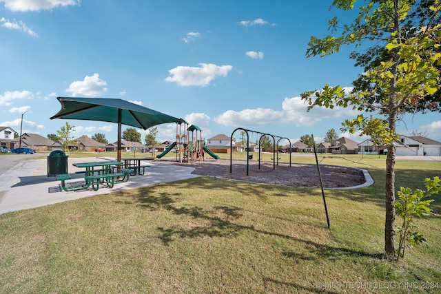 view of playground with a yard