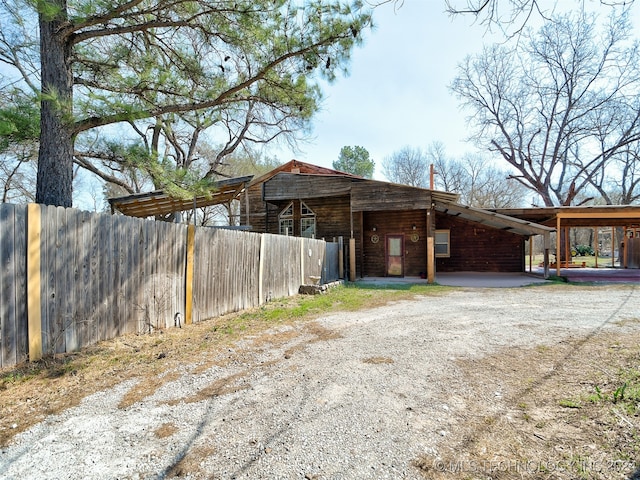 exterior space featuring a carport