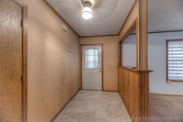 entryway featuring crown molding