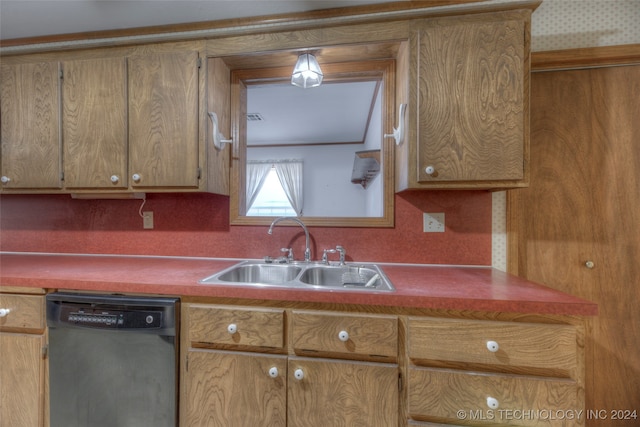 kitchen featuring black dishwasher, sink, and backsplash