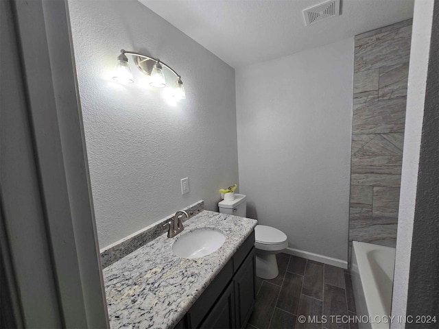 full bathroom with vanity, shower with separate bathtub, and toilet