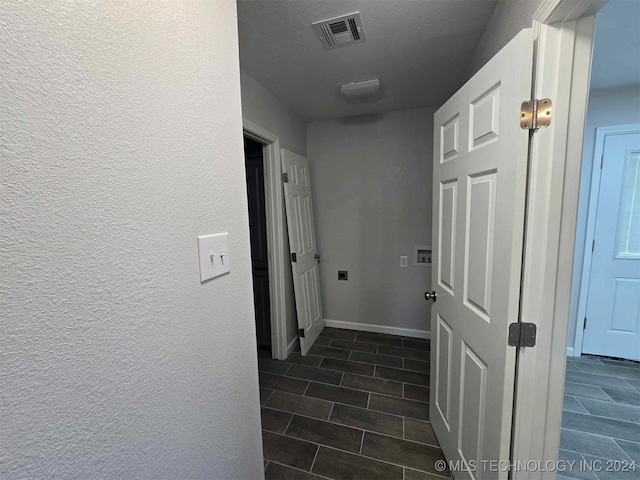 hall with dark wood-type flooring