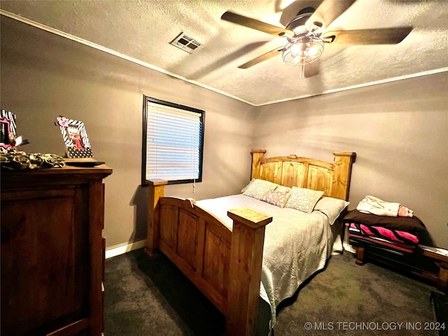 carpeted bedroom featuring a textured ceiling and ceiling fan