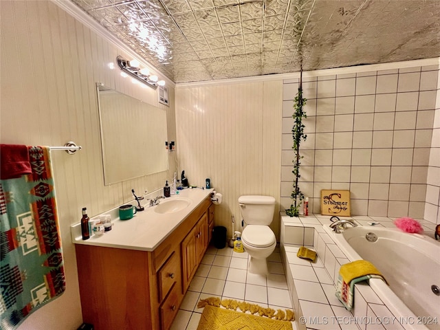 bathroom with vanity, ornamental molding, a bathing tub, tile patterned floors, and toilet