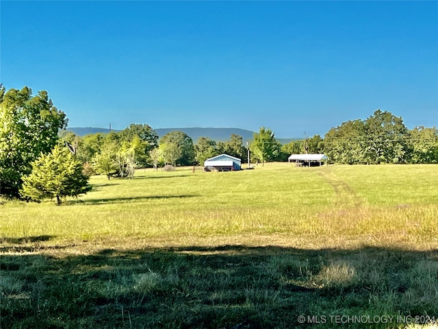 exterior space featuring a rural view and a mountain view