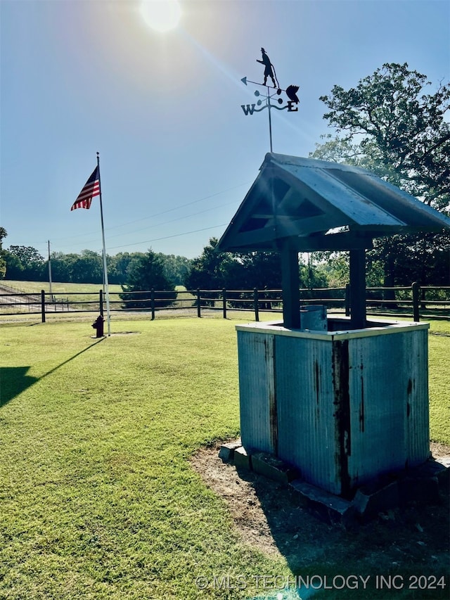 view of property's community featuring a rural view, a gazebo, and a lawn